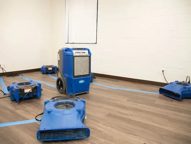 LGR dehumidifier and low-profile air movers drying a room